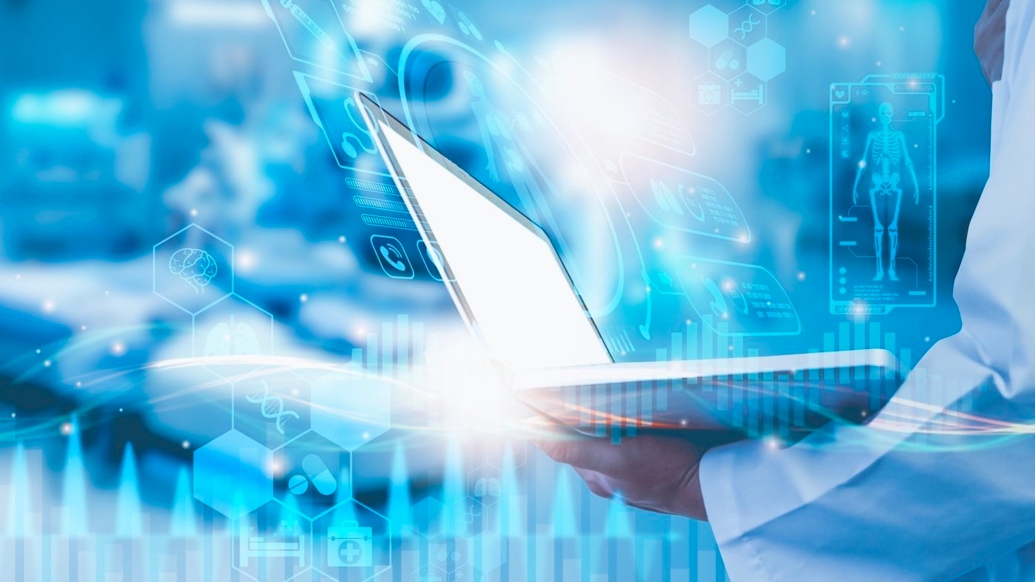 Scientist Hand Holding Laptop Data skeleton diagram blue background