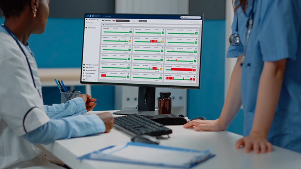 doctor nurse looking at computer screen