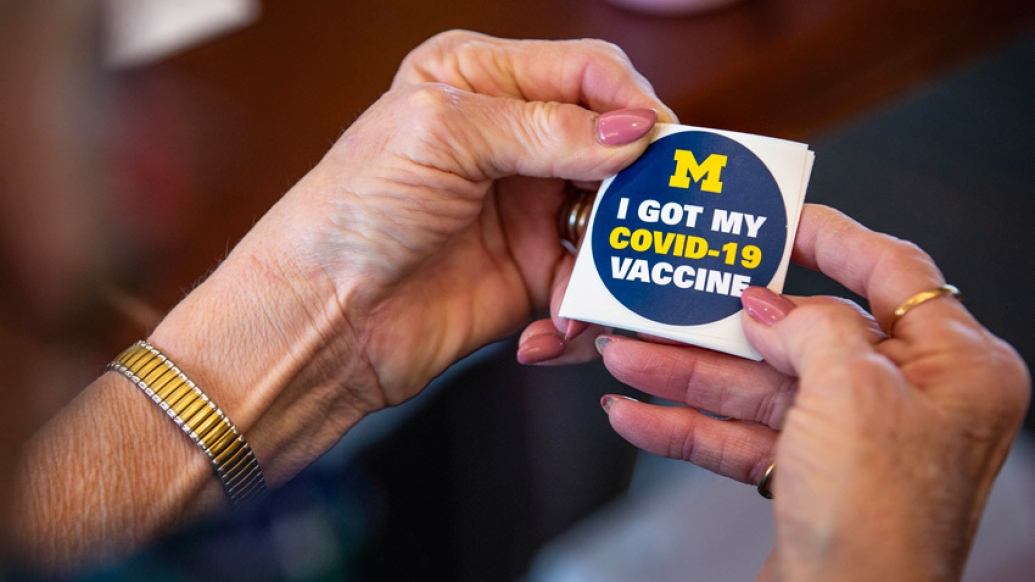 Hands Wristwatch Vaccination Sticker saying "I got my COVID vaccine"