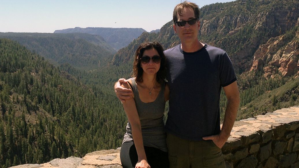 Dr. Stephen Chermack and his wife with mountains behind