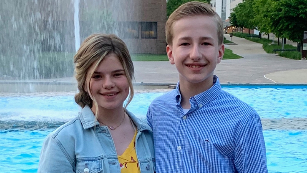 Kids standing by pool