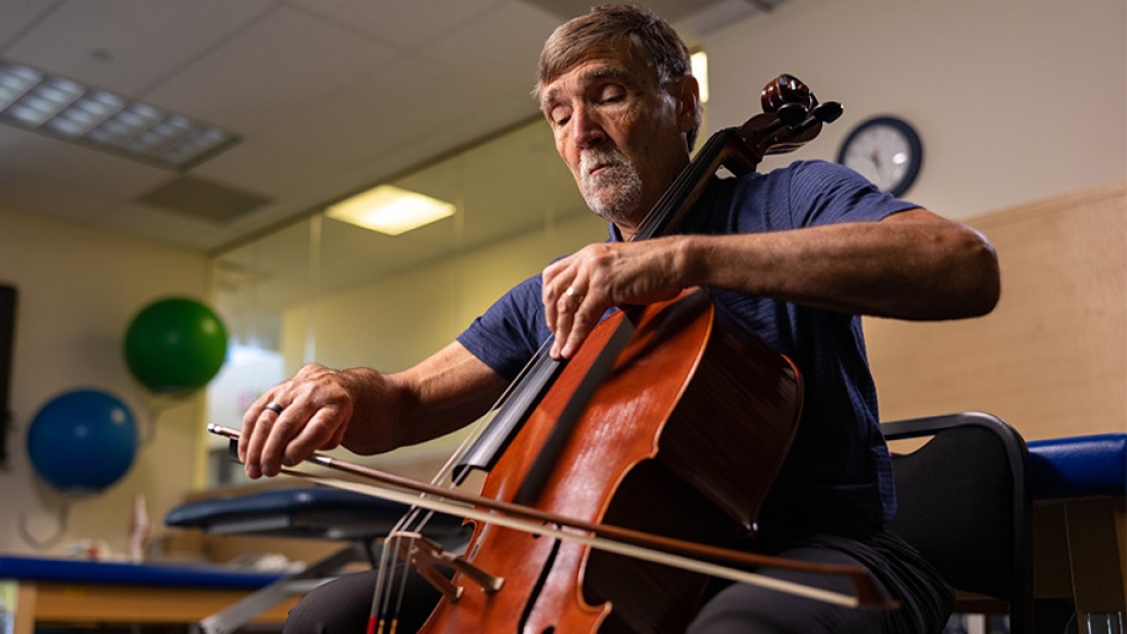 man playing instrument cello bass