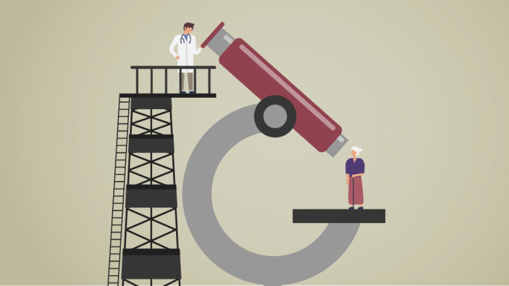 Doctor looking down at patient from above through a large, red microscope