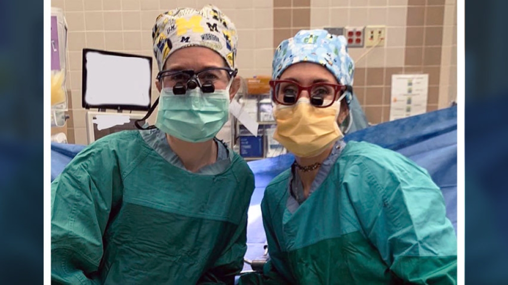 surgeons woman operating room gowns
