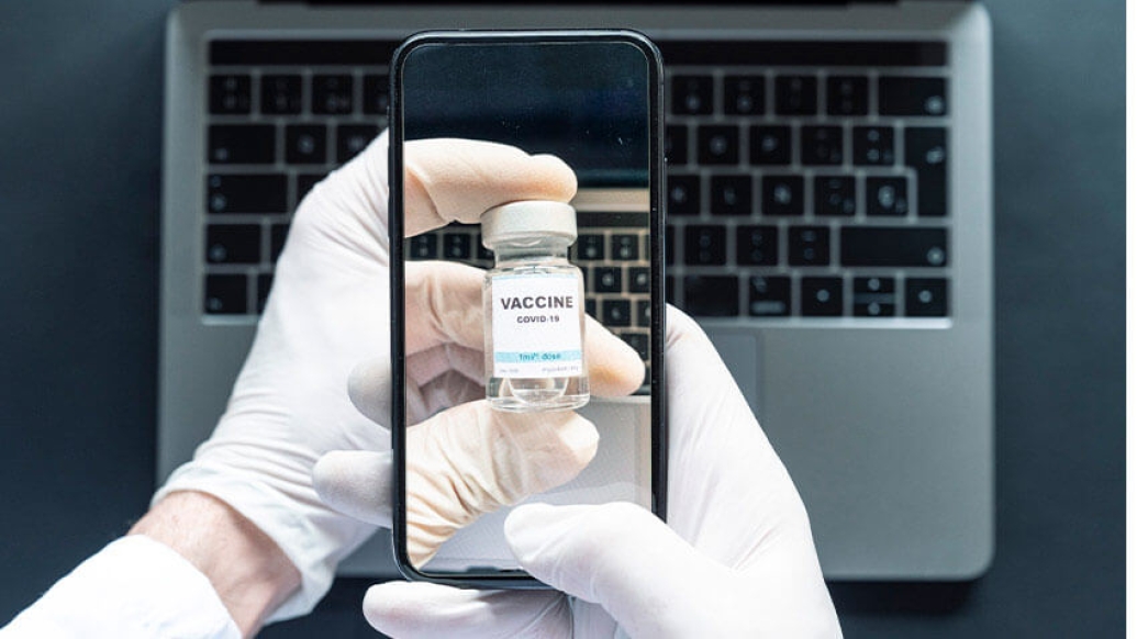 Iphone taking photo of vaccine