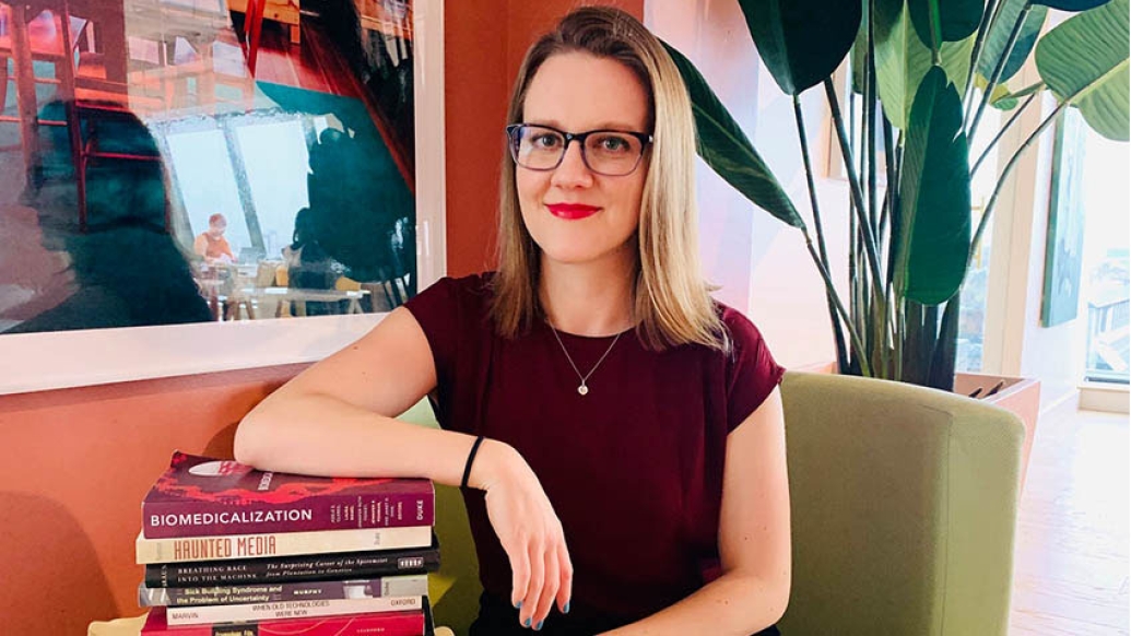 Photo of student with books