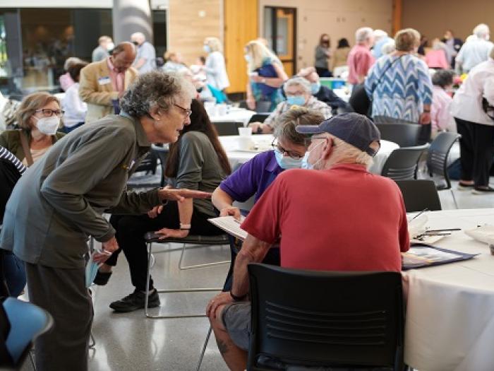 People interacting with each other at the OLLI kickoff event