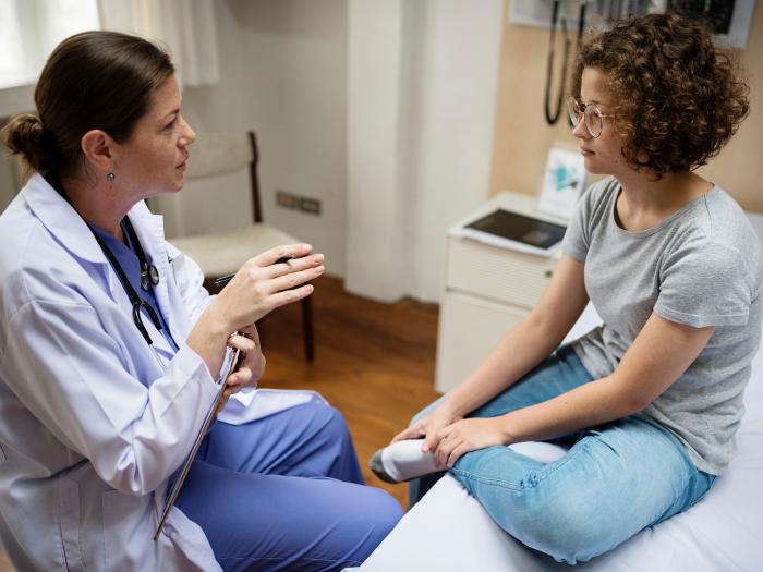 Doctor with teen girl