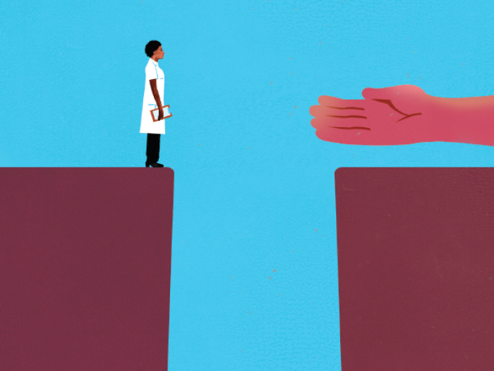 Illustration of a large hand helping a researcher cross a chasm