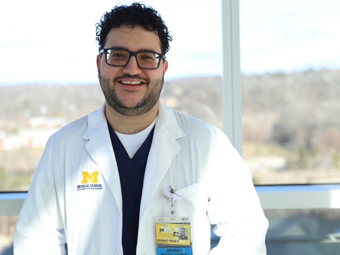 medical doctor smiling glasses brown hair