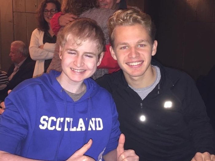 Alex Ramer smiles for a photo with his brother