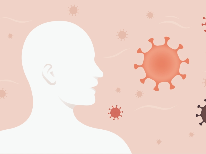 profile of person and covid cells floating around pinks 