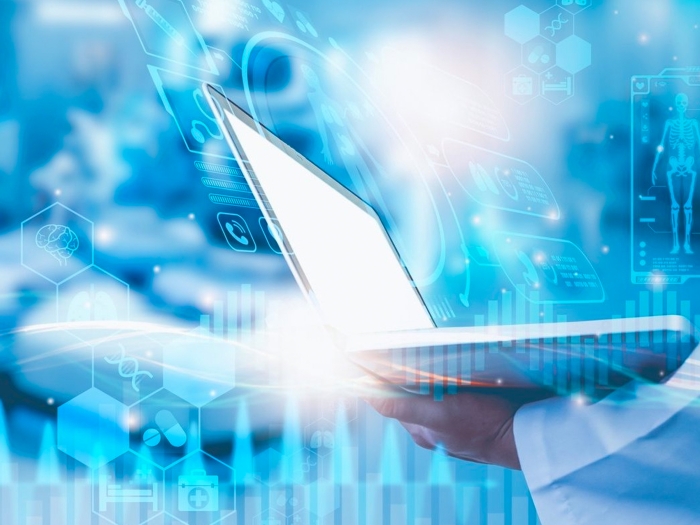 Scientist Hand Holding Laptop Data skeleton diagram blue background