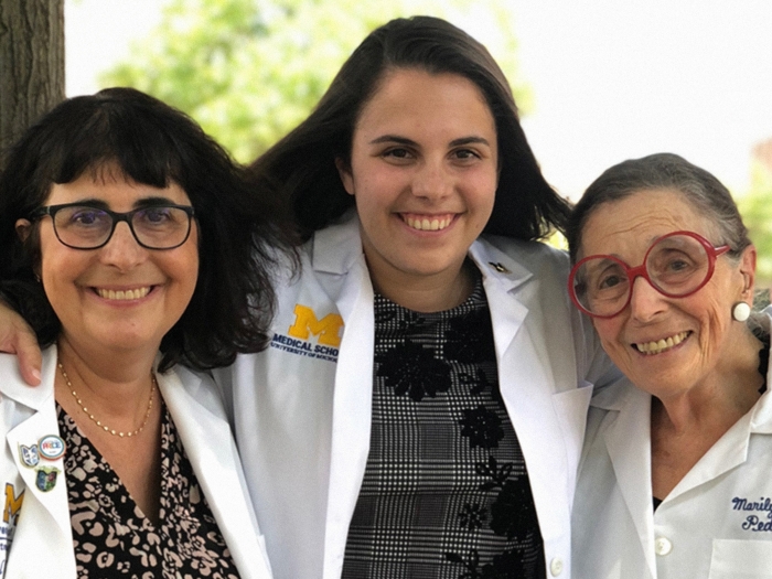 three women posing together