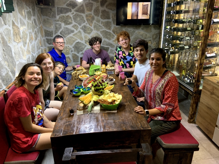 family sitting to eat out to dinner