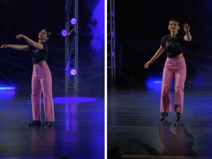 dancing in pink pants black shirt