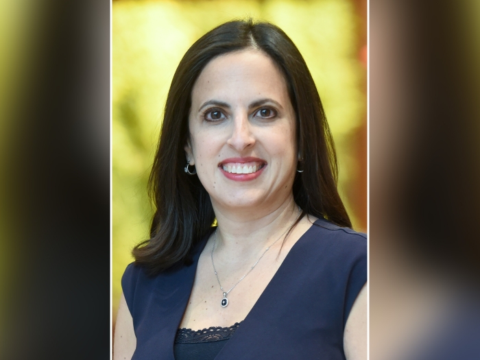 woman smiling portrait photo yellow background