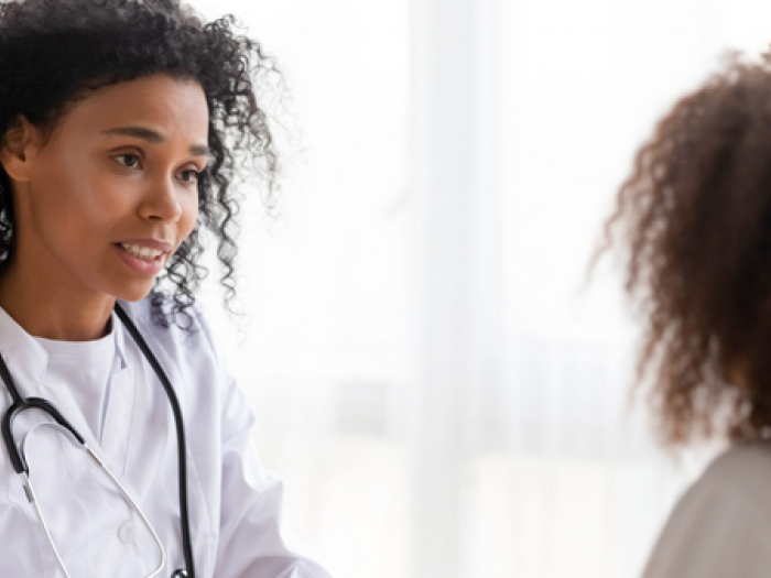 A provider and a young person engaged in conversation