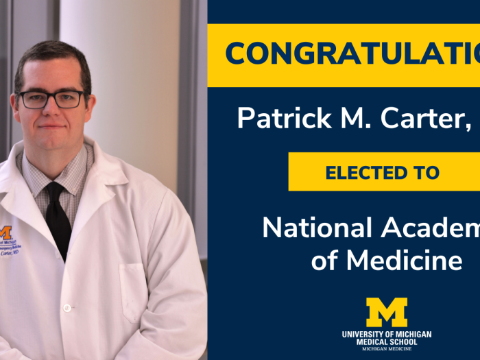 Carter in white coat, inducted to NAM