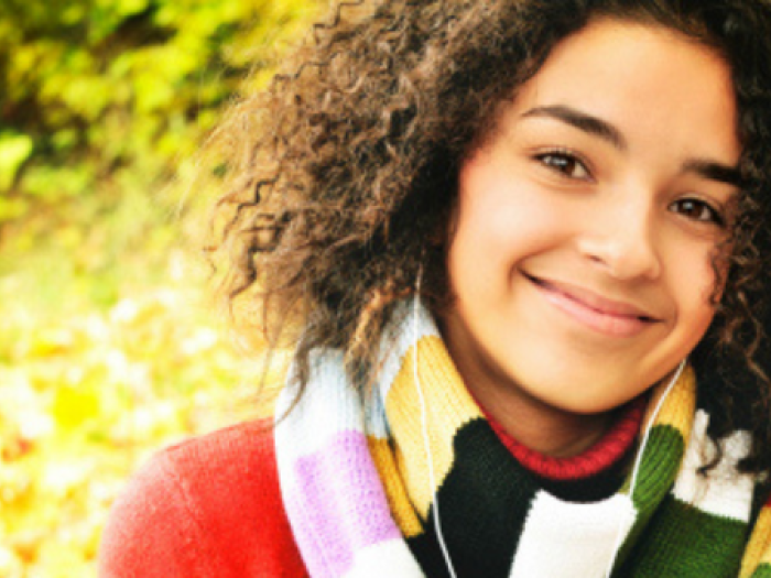 A girl smiles for the camera.