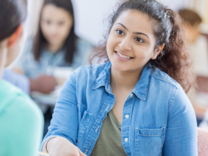 teen speaks with other female teen
