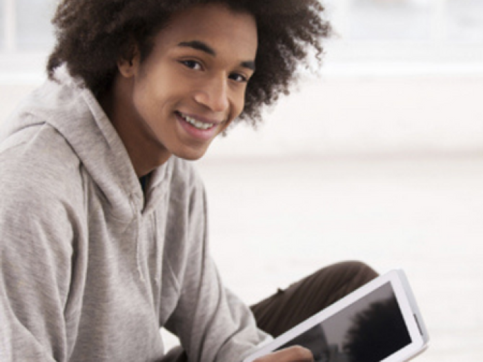 Teen boy smiles at camera