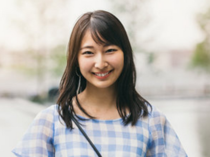 teen smiles at camera