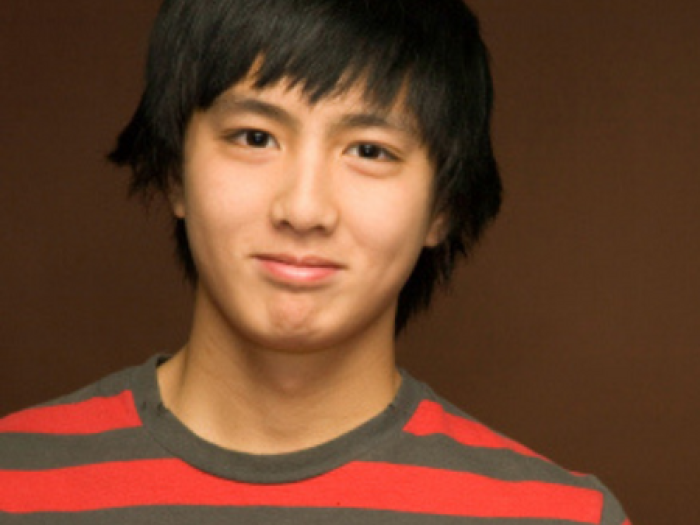 teen boy smiles at camera
