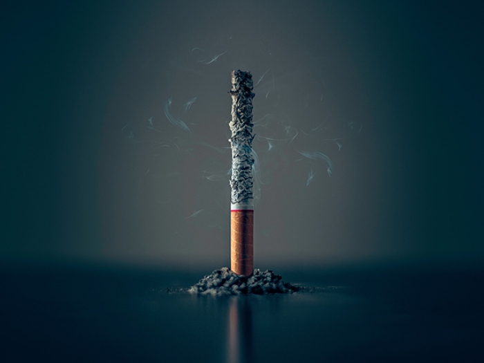 burnt cigarette smoke black grey background