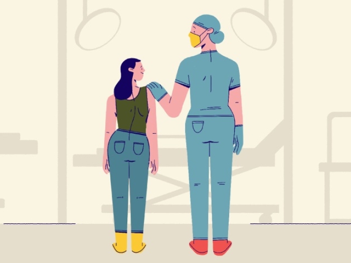 Child standing next to woman with hand on shoulder talking 