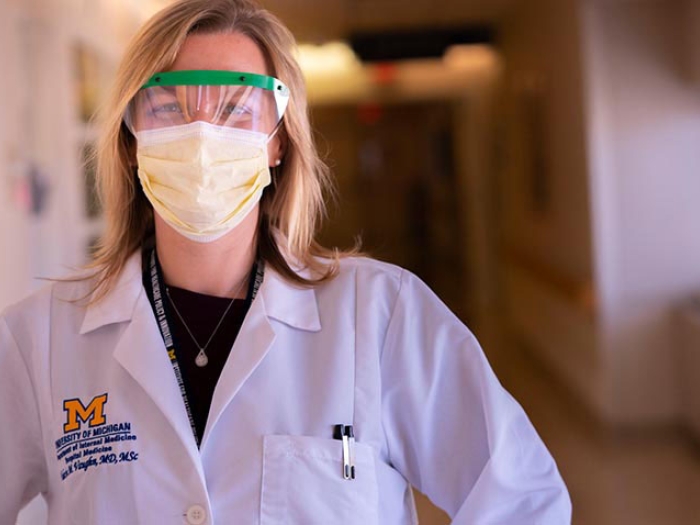 Dr. Vaughn in PPE in hallway