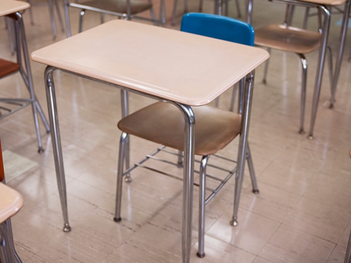 empty school desk classroom blue chair tan desk and silver metal 