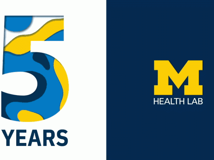 Number 5 with year underneath next to a block M