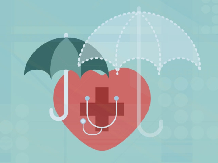 Red medical heart under two teal insurance umbrellas