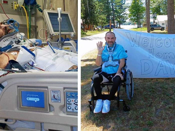 Man in hospital recovering. Man sitting by welcome home Dave banner smiling and waving while in wheelchair