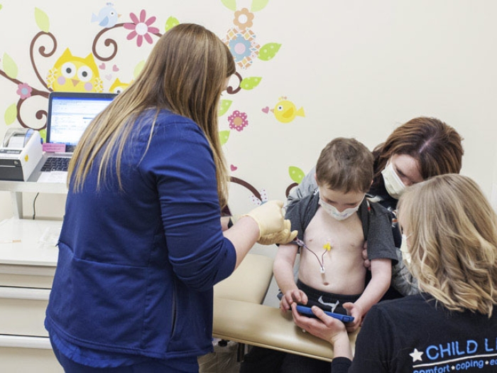 Nurse with children at patient mother clinic
