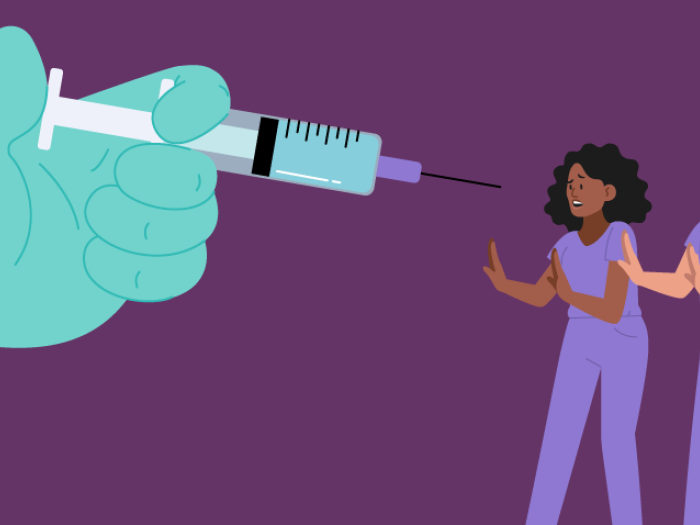 nurses retreat from glove hand with vaccine