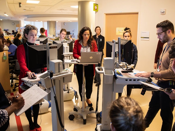 Pediatric heart care team rounding in cardiac critical care unit