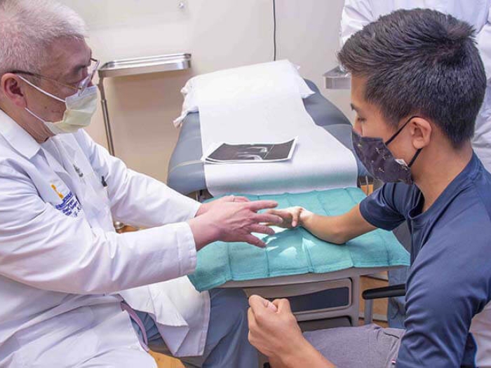 Pediatric hand specialist with patient