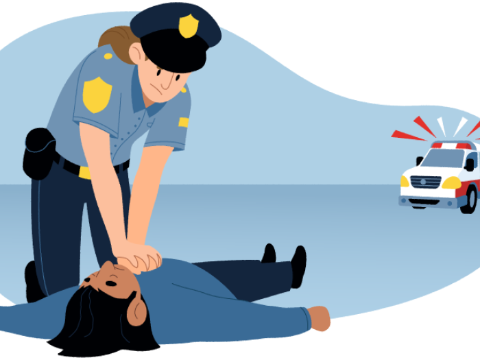 Police officer in uniform performing CPR to person lying on ground. Ambulance in  background.