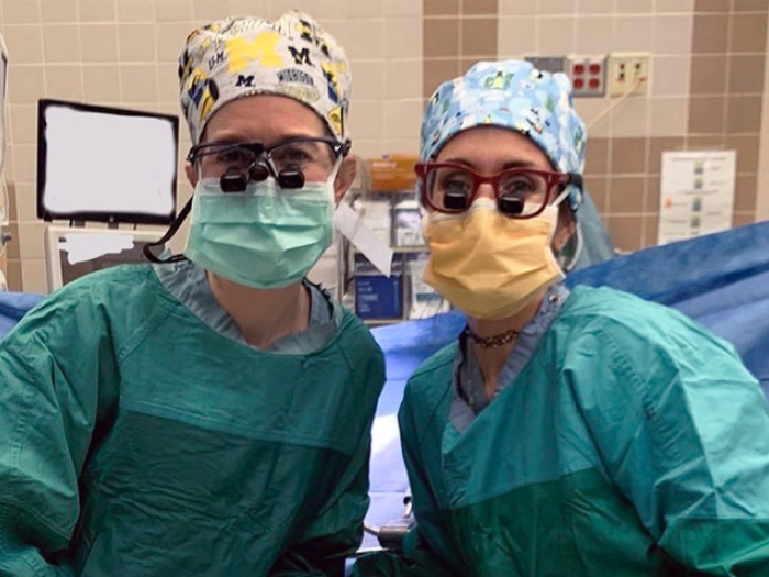 surgeons woman operating room gowns