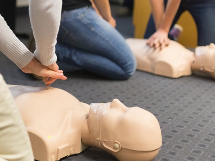 Students learning how to perform CPR