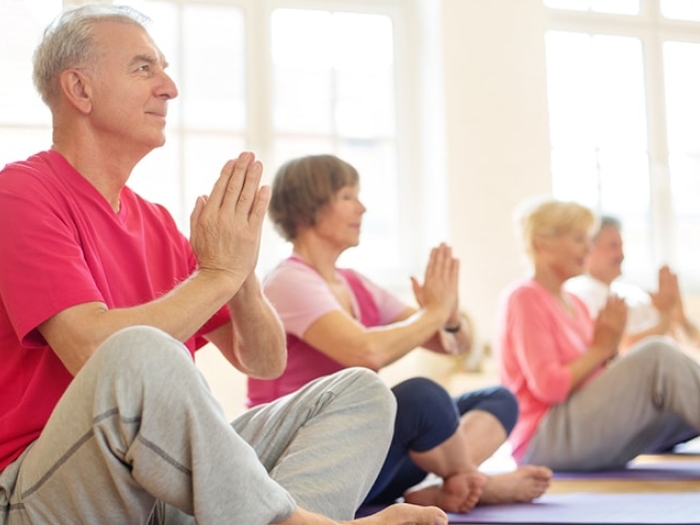 A group of seniors meditating