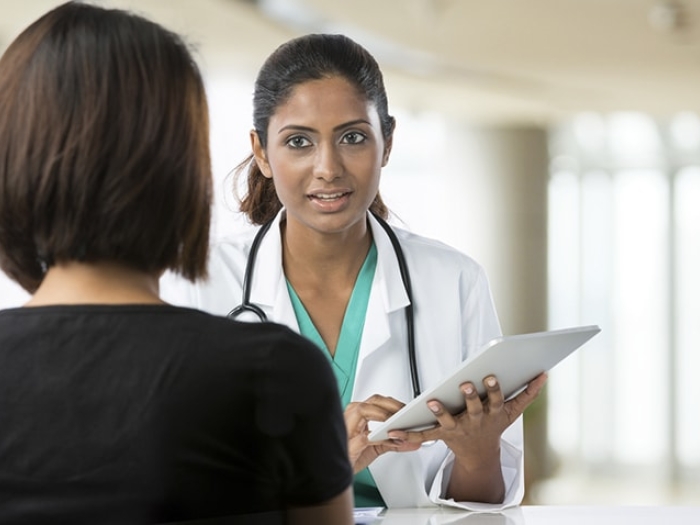 Oncologist and primary care physician working together on cancer treatment