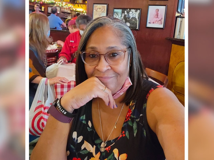 woman smiling glasses bracelets she loves to do