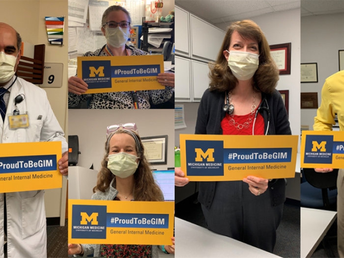 doctors standing holding signs that say proud to be GIM