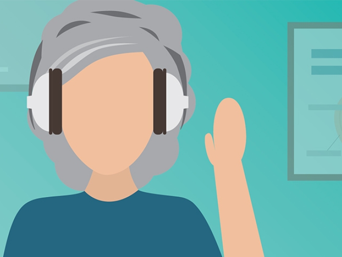 woman with grey hair with headphones on 