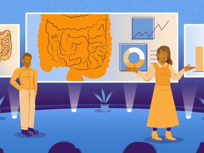 intestine conference man and women standing and talking on blue stage facing people