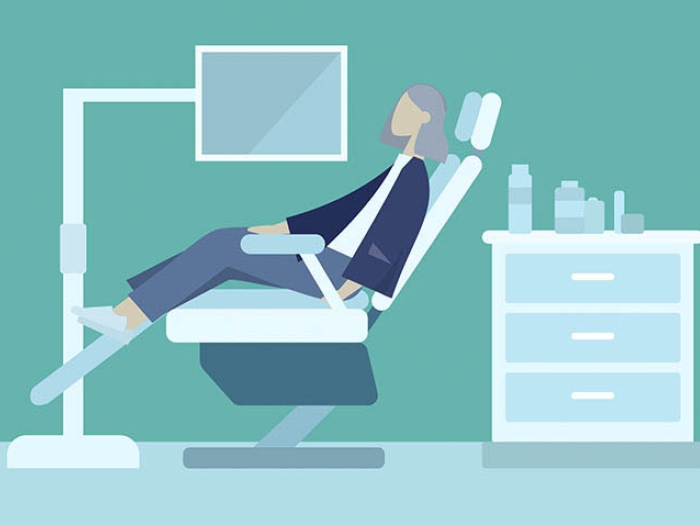 Lady in dental exam chair