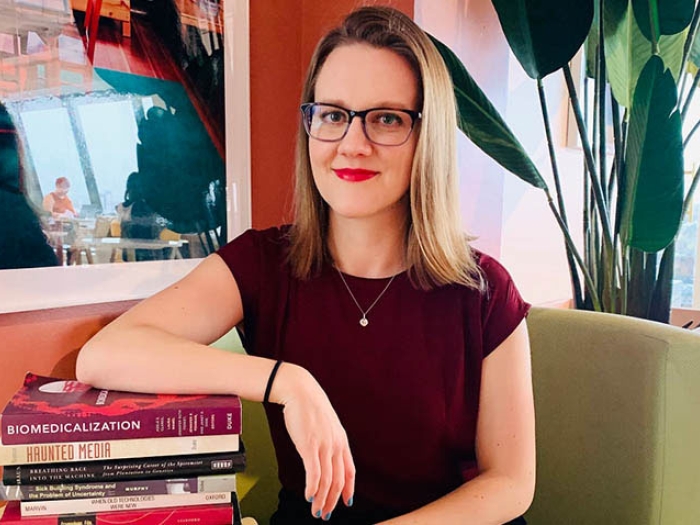 Photo of student with books